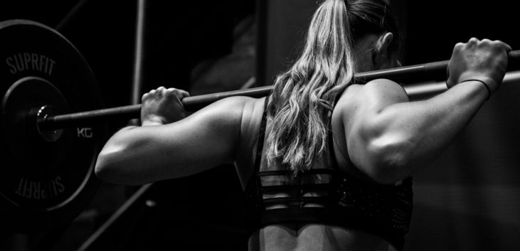 woman-lifting-barbell.jpg woman lifting barbell
